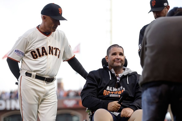 SAN FRANCISCO, CA - OCTOBER 25:  San Francisco Giants fan Bryan Stow with Tim Flannery #1 of the San Francisco Giants before Stow yells Play Ball! before Game Four of the 2014 World Series at AT&T Park on October 25, 2014 in San Francisco, California.  (Photo by Ezra Shaw/Getty Images)