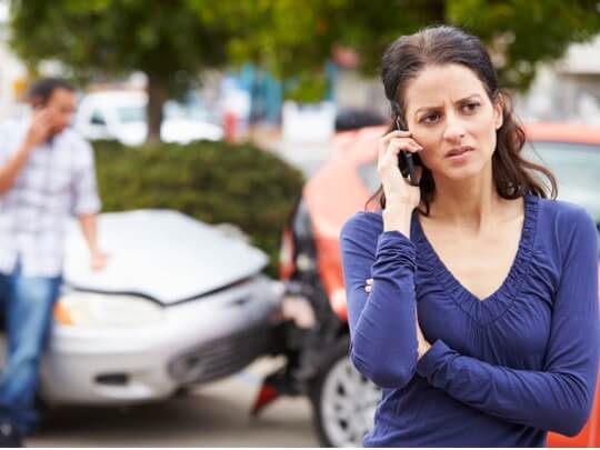 woman looking concerned after a car accident