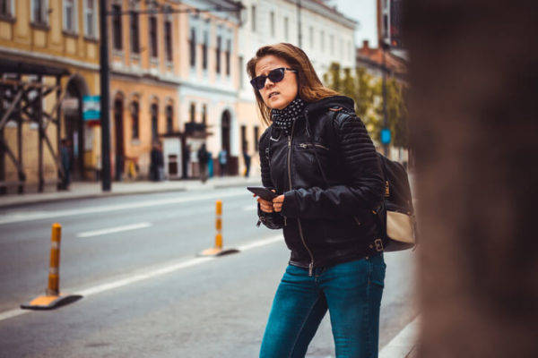 woman waiting for a rideshare driver