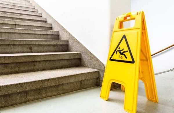 slip and fall warning sign near stairs