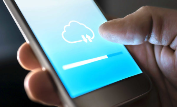 Cloud service for file storage and backup online. Data transfer in mobile phone app with modern wireless technology. Uploading, downloading or sync. Loading information to network. Computing concept.