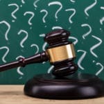 Gavel with question marks