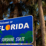 Wign on the highway welcoming drivers to Florida the Sunshine State
