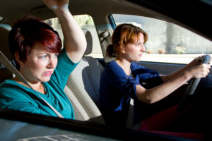two women bracing for a car crash accident