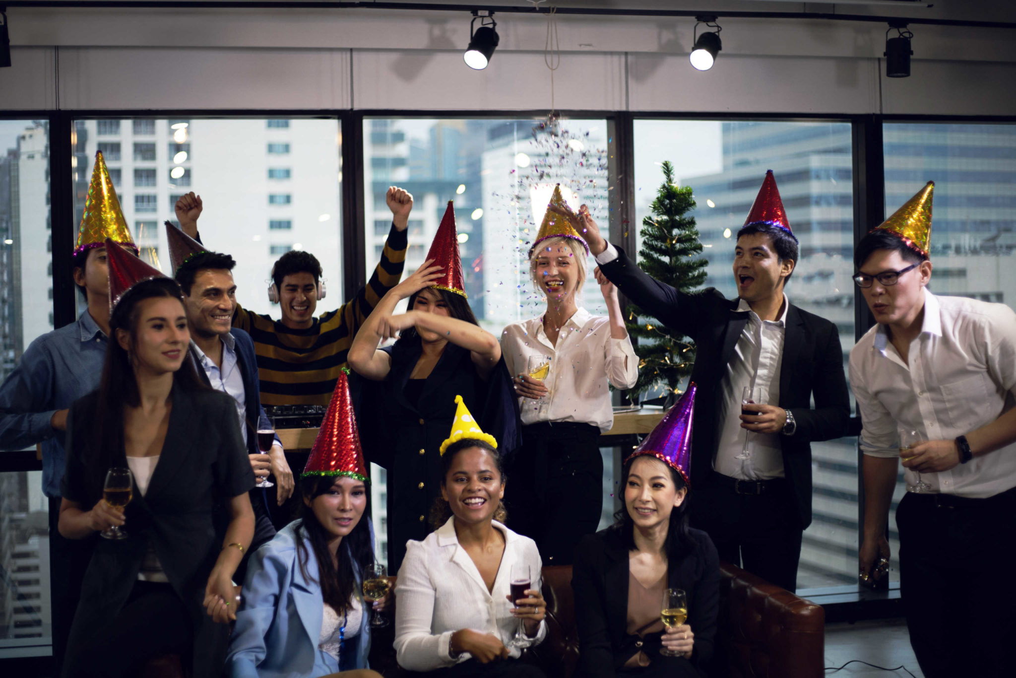 Close-up smiling Businesspeople on New Year Party in Office and celebrating of New Year small group.