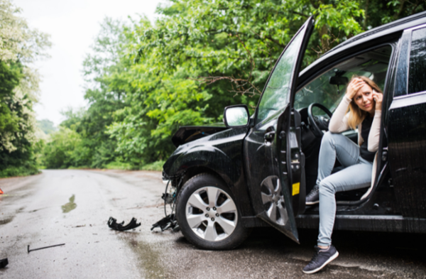 woman on phone after car accident