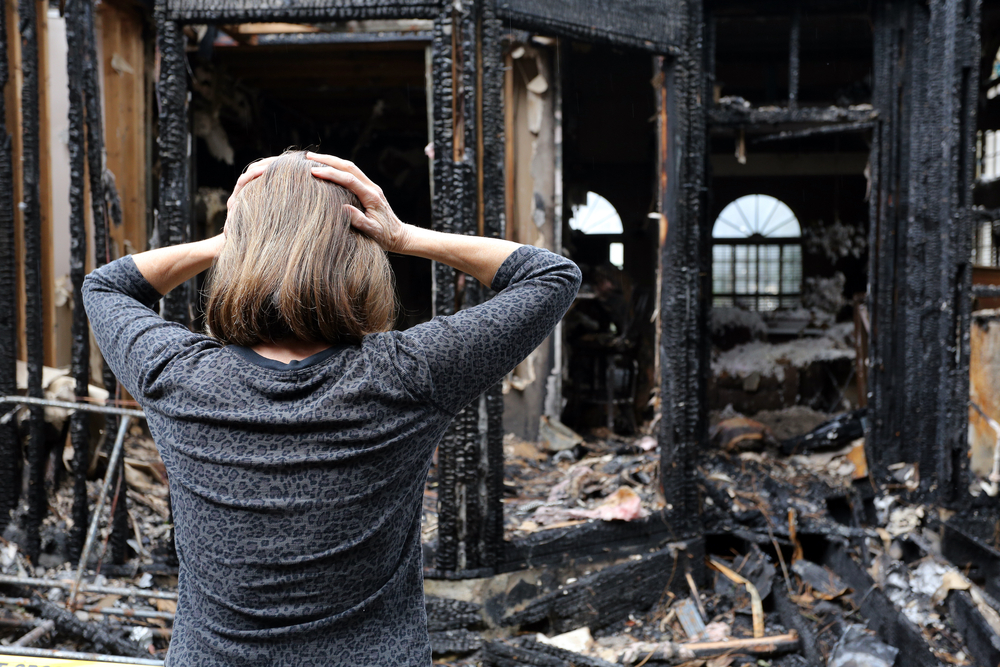 Woman upset after a house fire