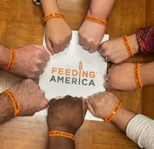 Steinger Greene and Feiner orange bracelets to raise money to fight hunger for Feeding America
